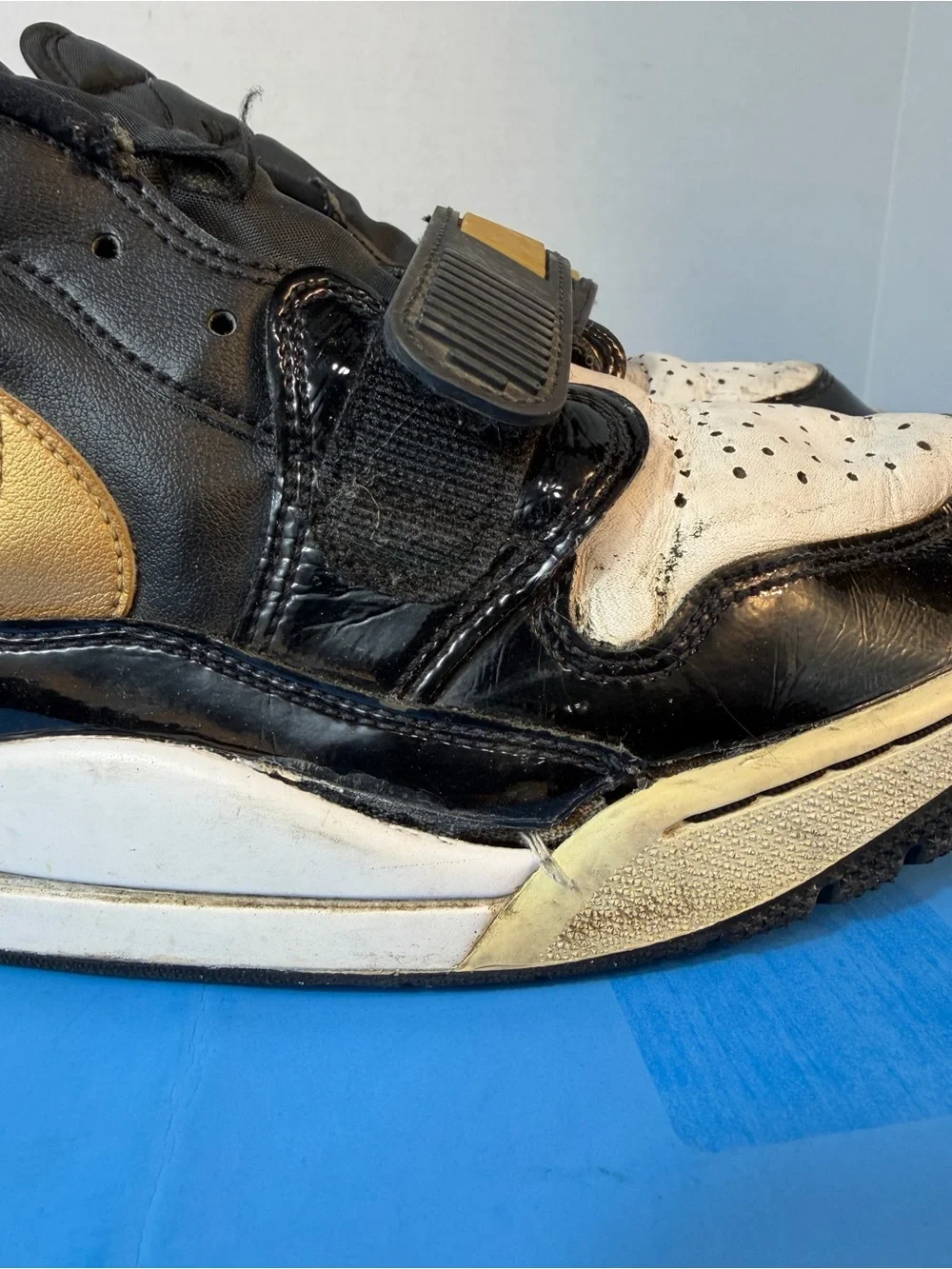 Jordan Black, White & Gold Strap Sneakers